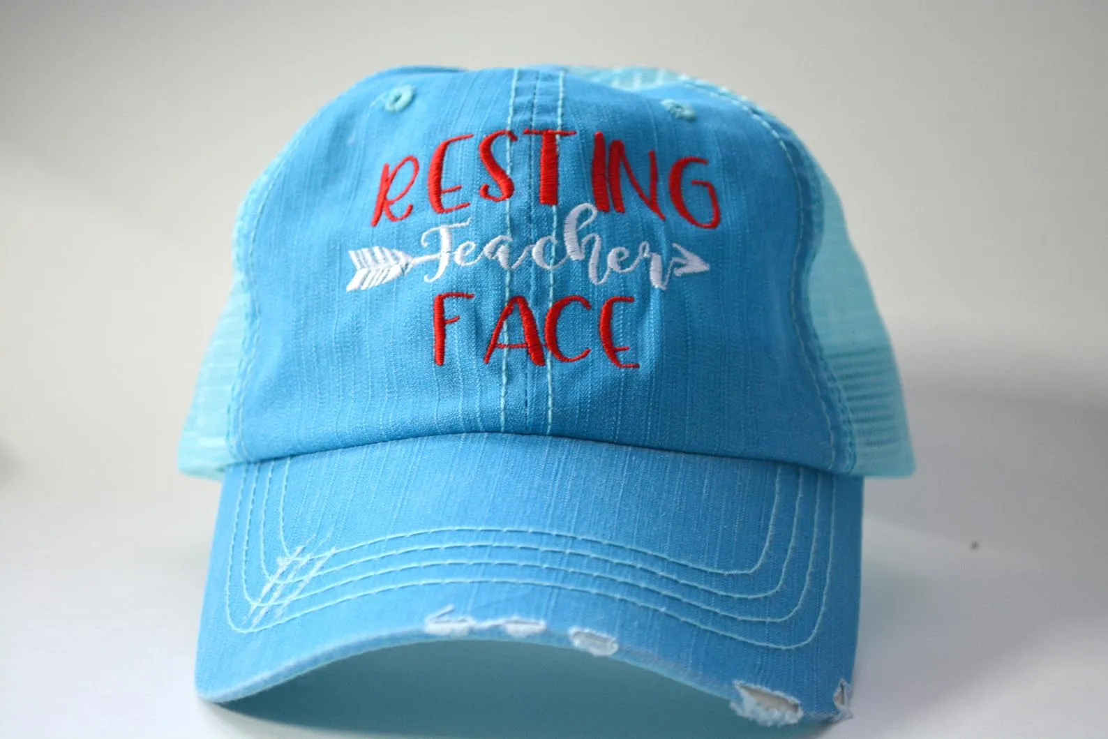 Resting Teacher Face Arrow Trucker Hat